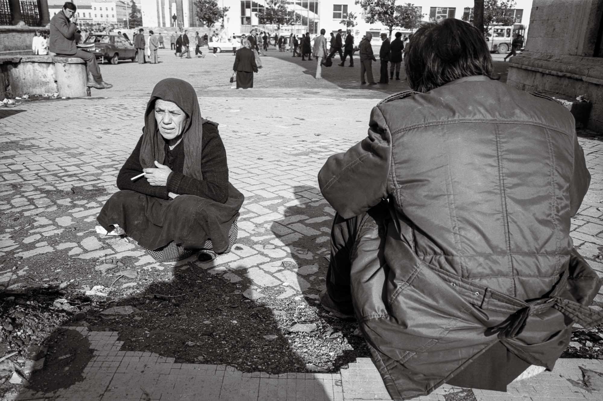 Bart-Deseyn-photographer-albania-1992-2 Old woman smoking in Skanderbeg Square photographed in 1992 in Albania, Tirana