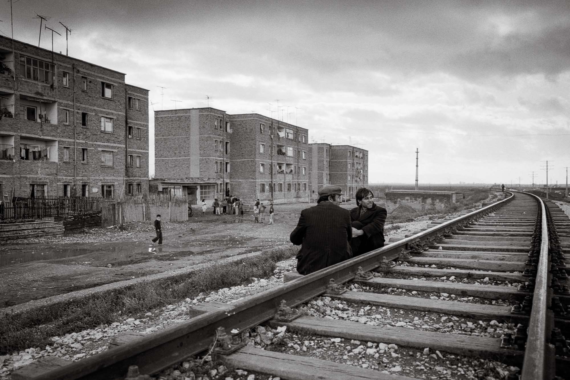 Bart-Deseyn-photographer-albania-1992-23 Men chatting on rail track photographed in 1992 in Albania, Lezhë region
