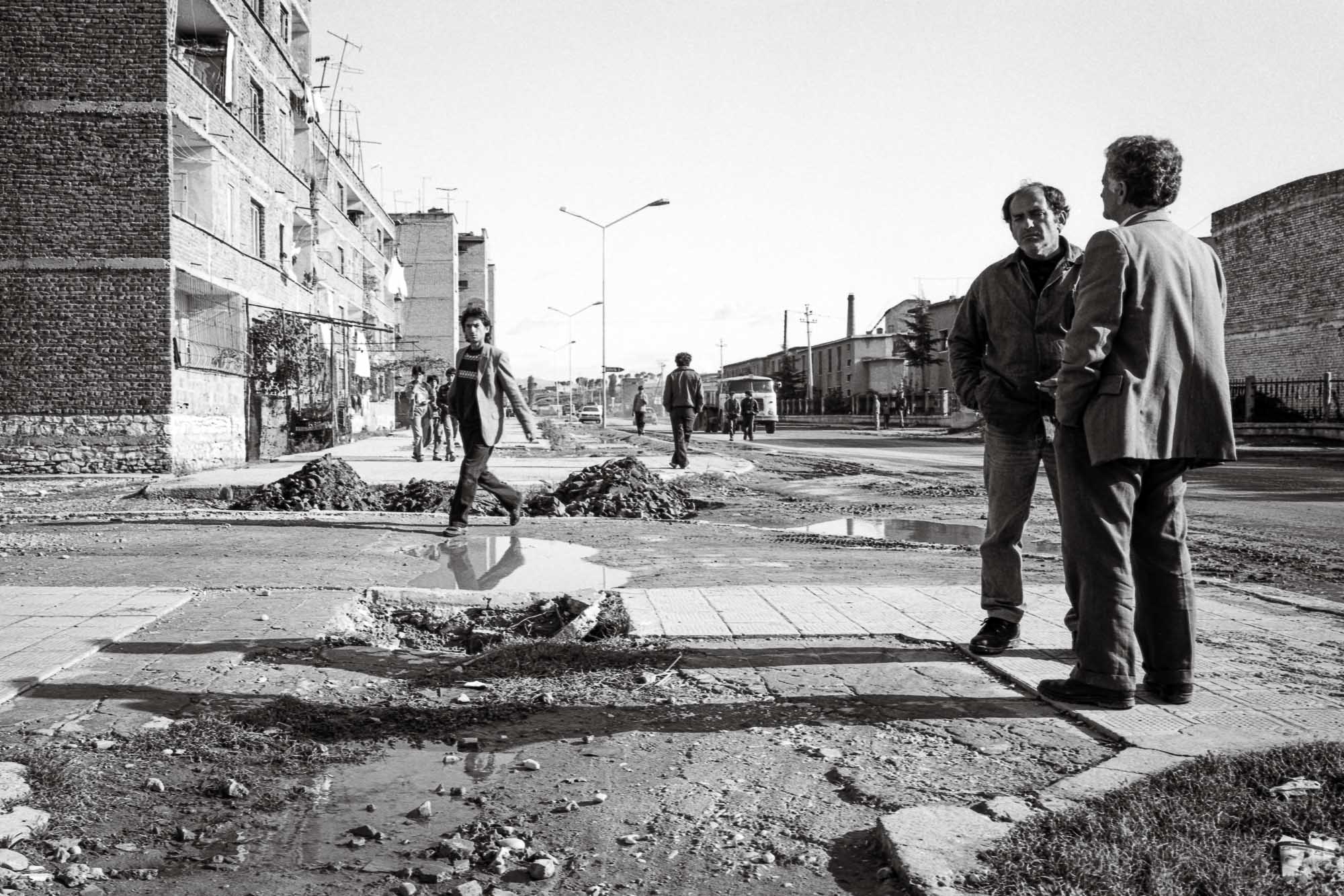 Bart-Deseyn-photographer-albania-1992-36 Men chatting in the street photographed in 1992 in Albania, Tirana